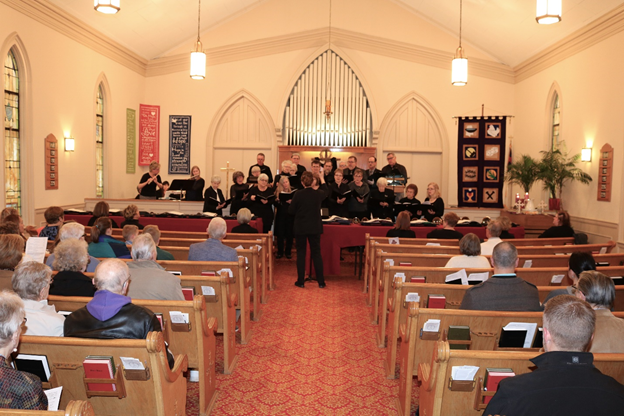 The choirs from First Congregational Church and St. Paul’s Lutheran Church singing together during the 2019 joint Good Friday service by both congregations at FCC