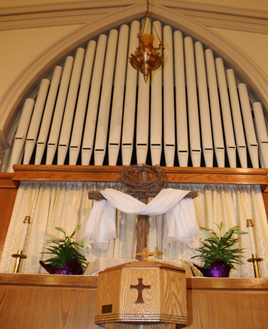Easter Sunday altar and baptismal font. Christ the Lord is Risen!